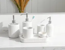make white marble bathroom organiser like soap dispensor, toothbrush holder , soap dish, candle pot, dispenser, set etc in different ribbed shape on solid white backgorun without ground shadow